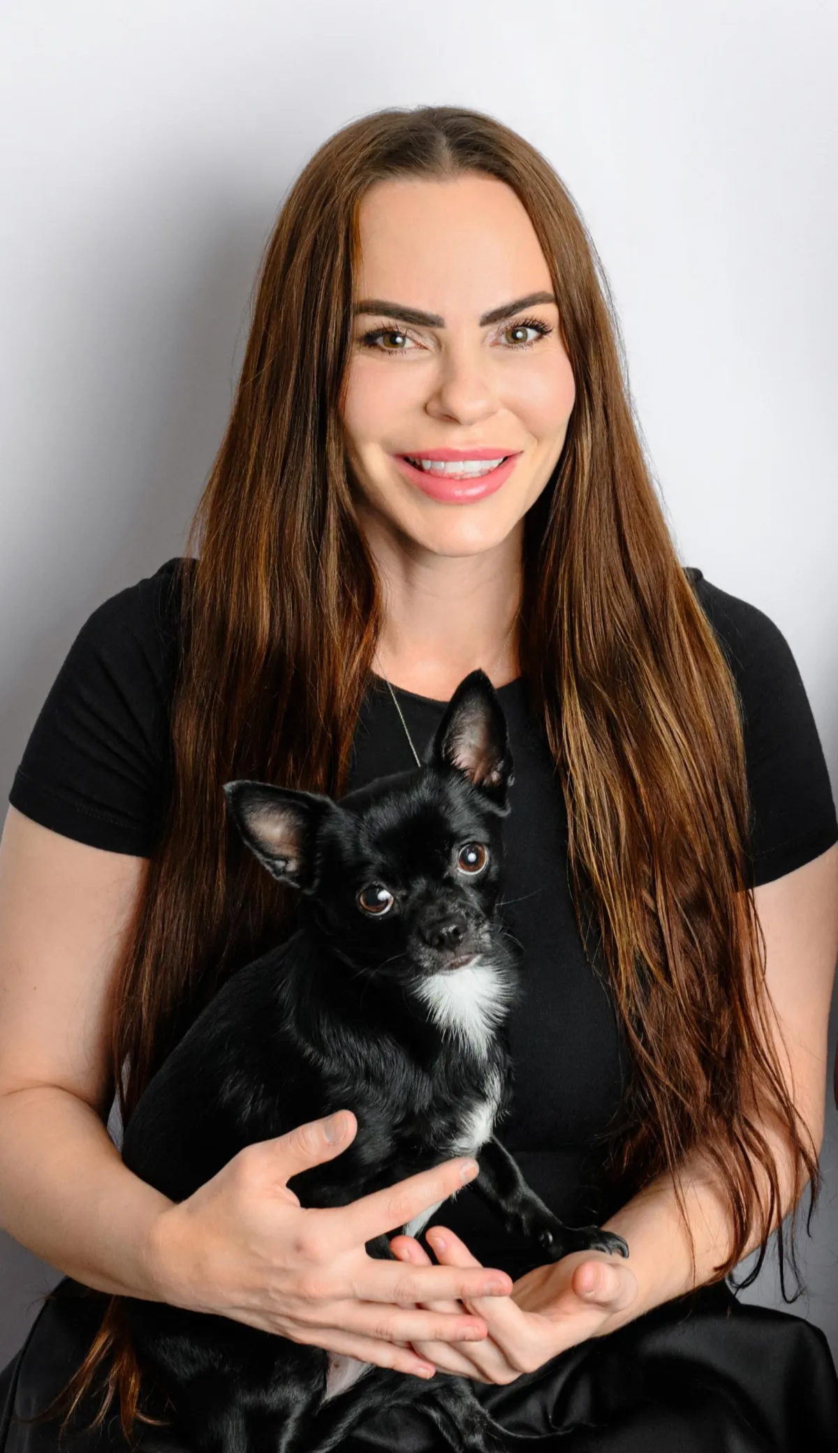 Justine Coupland, founder of LUNA Systems, with her chihuahua Luna